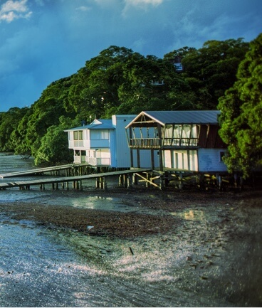 house on the beach at sunset